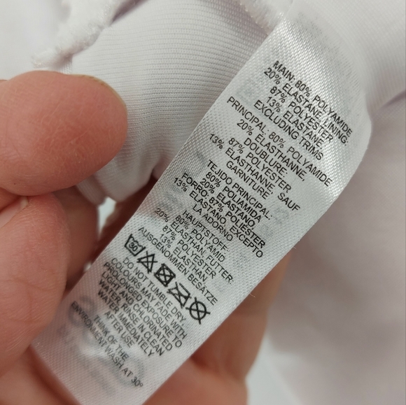 ASOS DESIGN skinny strap deep plunge tie front swimsuit in shiny white - Picture 9 of 9